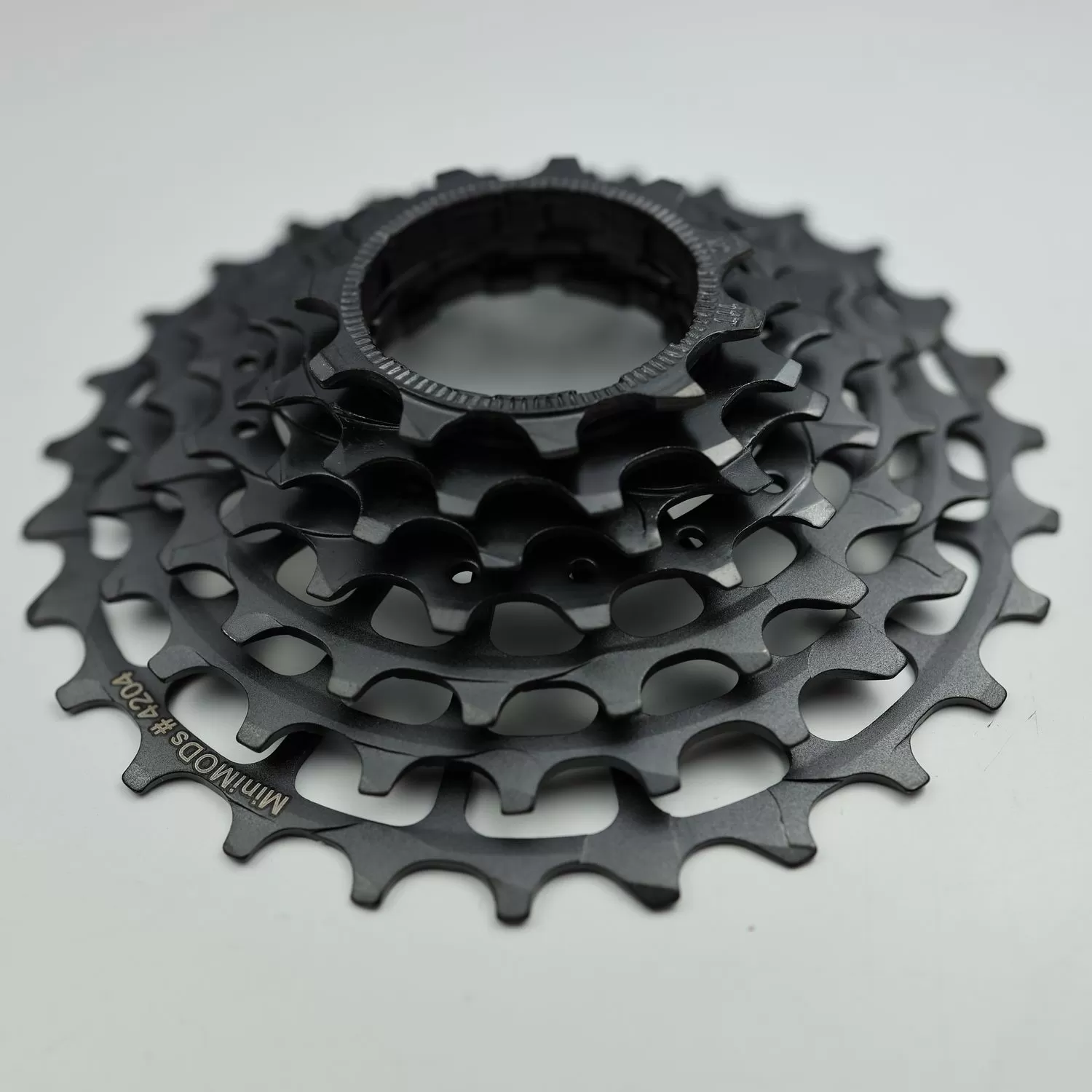 Bộ líp 7 số MiniMODs X7 Semi-Integrated Cog Set - Black